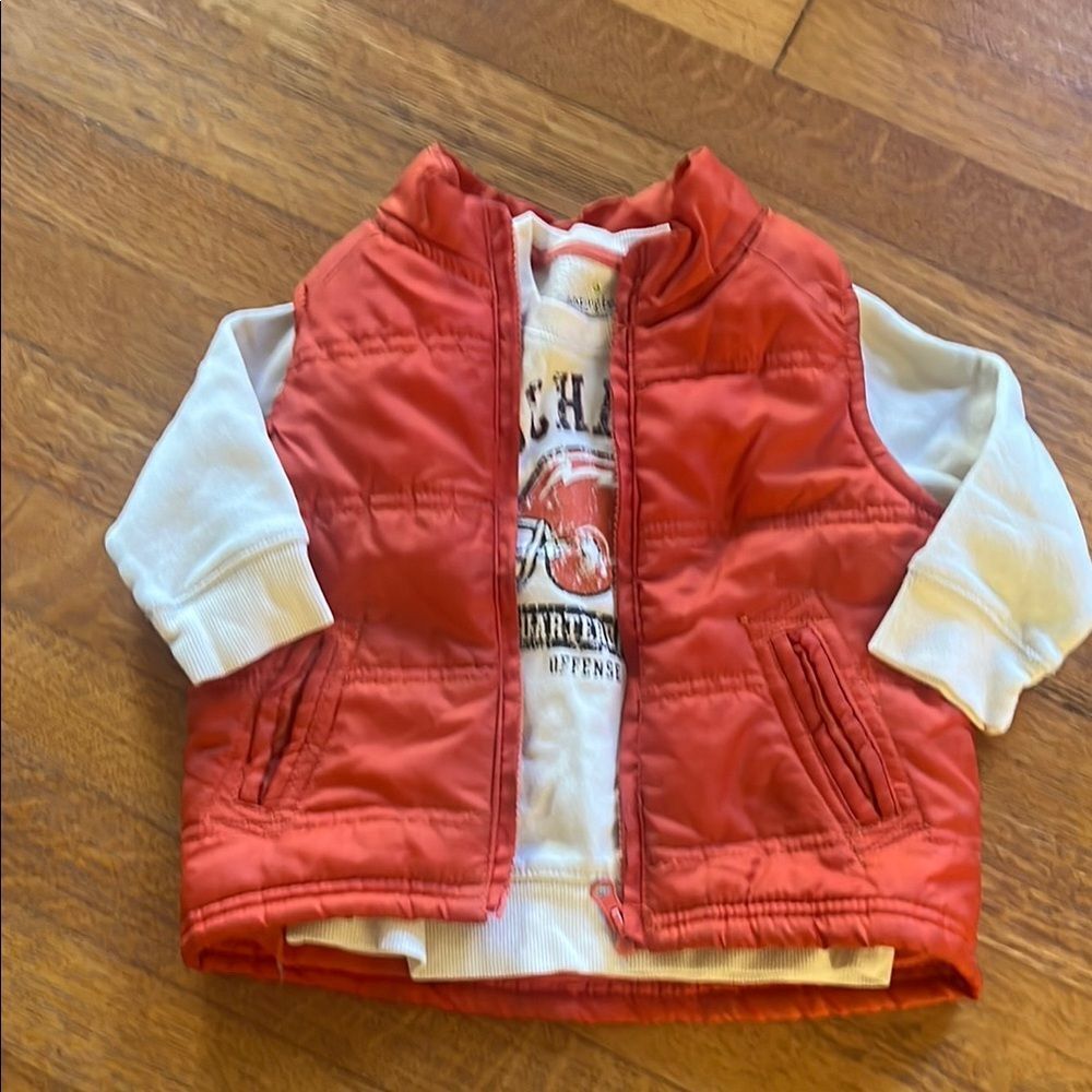Red Puffer Vest with White Long Sleeve Sweatshirt